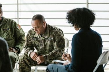 soldiers in counseling by rdne stock project