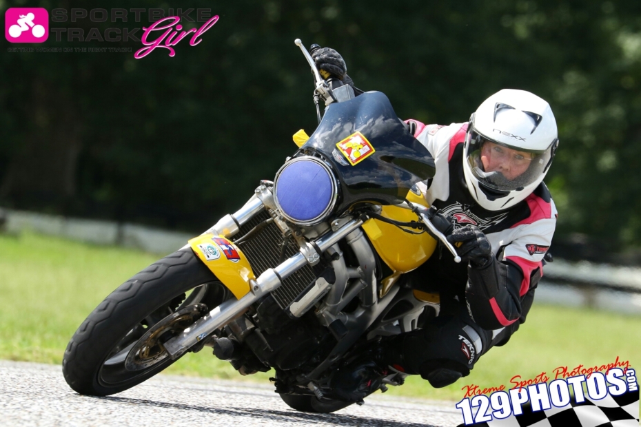 Michelle Cleveland leaning into a turn on her motorcycle
